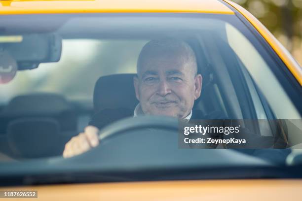the taxi driver. - taxi driver stock pictures, royalty-free photos & images