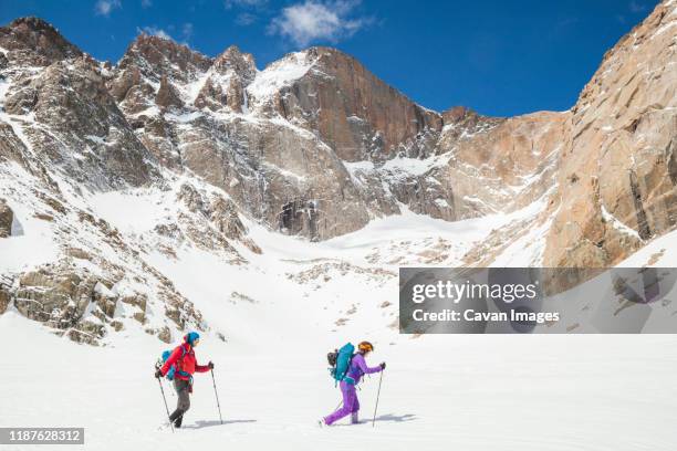 climbers hike below longs peak, rocky mountain national park - rocky mountain national park ストックフォトと画像