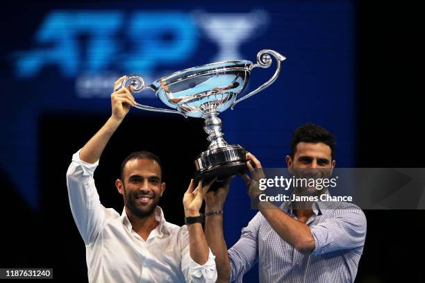 Juan Sebastian Cabal and Robert Farah of Colombia pose with their trophy after being announced as doubles world number one the during Day Five of the...