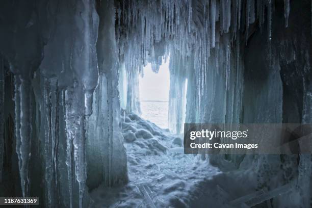 frozen ice cave from baikal lake. - stalactiet stockfoto's en -beelden