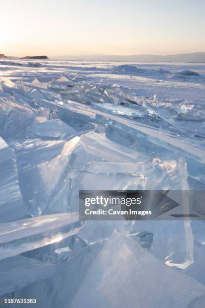 ice cracks in baikal lake. - ice shelf stock-fotos und bilder