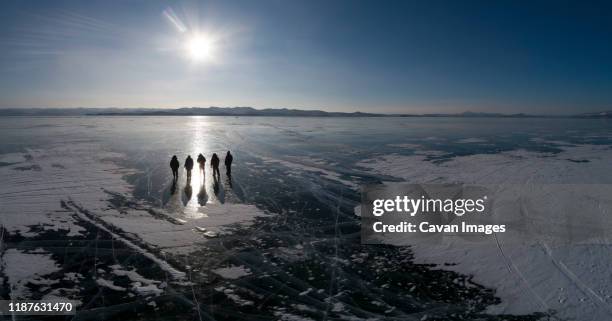 people silouette over ice from aerial view - baikal stockfoto's en -beelden