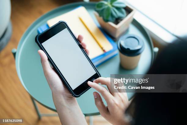 closeup hands using smartphone mockup at the office desk. - showing mobile stock pictures, royalty-free photos & images