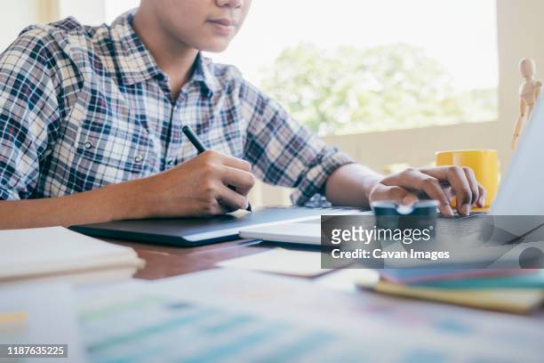 graphic design and color swatches and pens on a desk. - animatör bildbanksfoton och bilder