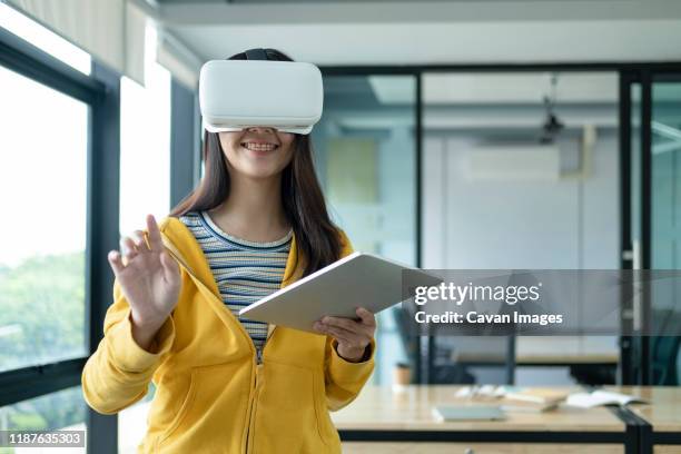 young programmer with virtual reality glasses to testing 3d appl - web programmer stock pictures, royalty-free photos & images