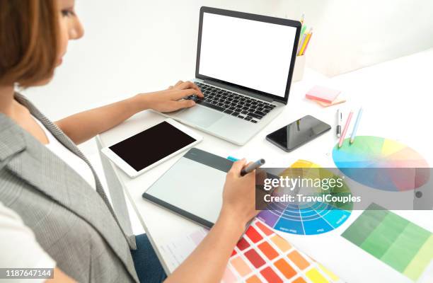 graphic designer at work. color swatch samples. artist drawing something on graphic tablet at the office. graphic designer creativity editor ideas designer concept - my tablet tool stock pictures, royalty-free photos & images