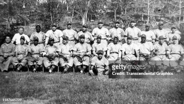 Team portrait of the Almendares baseball team as they pose on the grass at Tropical Park, Havana, Cuba, 1935. Among those pictured are players Adolfo...