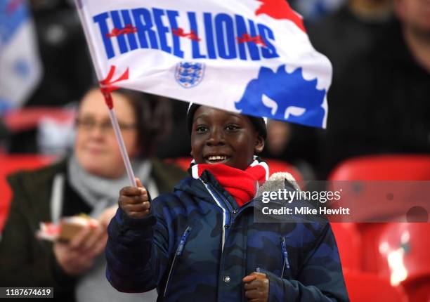 Fans arrive at the stadium prior to the UEFA Euro 2020 qualifier between England and Montenegro at Wembley Stadium on November 14, 2019 in London,...