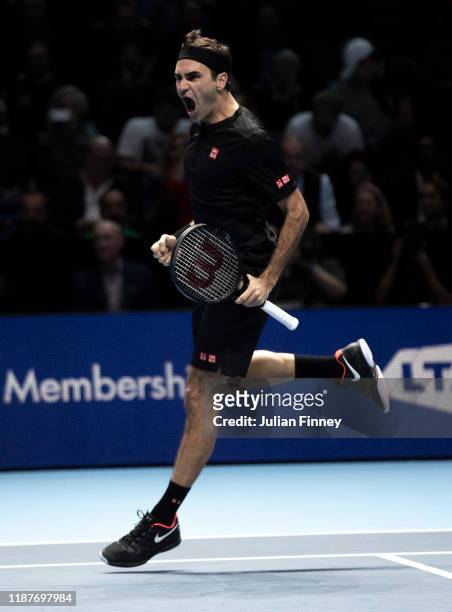 Roger Federer of Switzerland celebrates match point in his singles match against Novak Djokovic of Serbia during Day Five of the Nitto ATP Finals at...