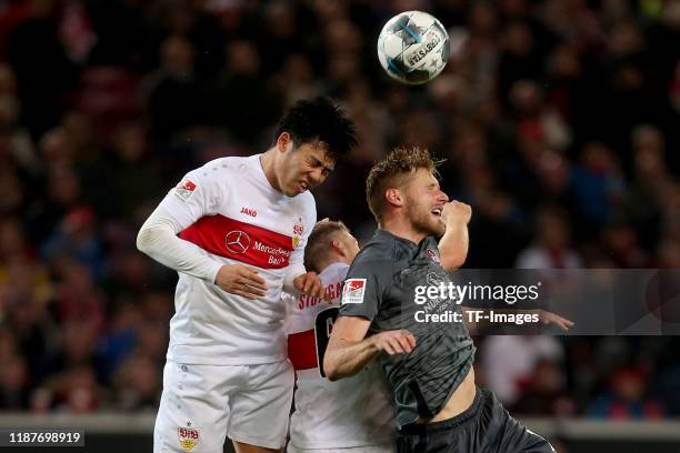 Wataru Endo of VfB Stuttgart and Hanno Behrens of 1. FC Nuernberg battle for the ball during the Second Bundesliga match between VfB Stuttgart and 1....