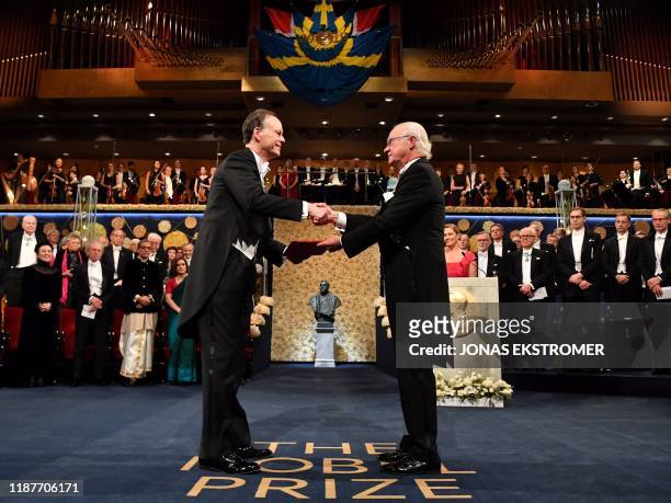 Professor of medicine and co-laureate of the 2019 Nobel Prize in Physiology or Medicine William G. Kaelin receives his Nobel Prize from King Carl XVI...