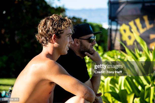 Griffin Colapinto of USA and Jake Patterson watch the waves at the Pipe Invitational, the trials of the 2019 Billabong Pipe Masters at Pipeline on...