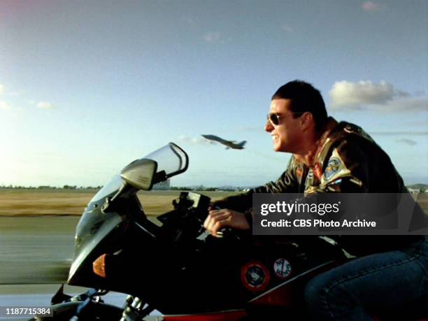 The movie "Top Gun", directed by Tony Scott. Seen here, Tom Cruise as Lt. Pete "Maverick" Mitchell riding a Kawasaki GPZ 900 R. Initial theatrical...