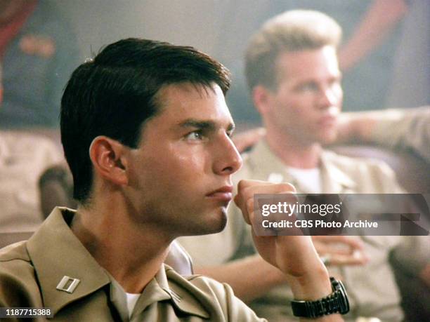 The movie "Top Gun", directed by Tony Scott. Seen here in foreground, Tom Cruise as Lt. Pete "Maverick" Mitchell. In background, Val Kilmer as Lt....