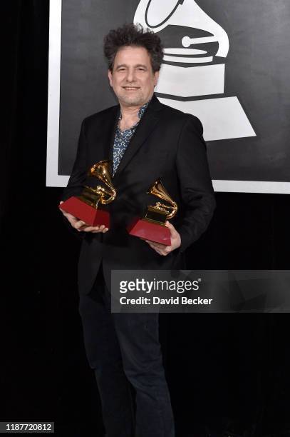 Andrés Calamaro, poses with awards for Best Rock Song and Best Pop/ Rock Album backstage at the Premiere Ceremony during the 20th annual Latin GRAMMY...