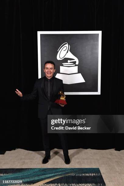 Fonseca poses with award for Best Traditional Pop Album backstage at the Premiere Ceremony during the 20th annual Latin GRAMMY Awards at MGM Grand...
