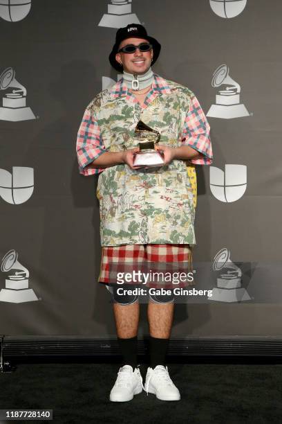 Bad Bunny poses withe the Best Urban Music Album in the press room during the 20th annual Latin GRAMMY Awards at MGM Grand Garden Arena on November...