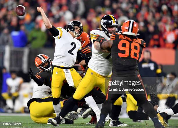 Quarterback Mason Rudolph of the Pittsburgh Steelers is tackled by the defense of the Pittsburgh Steelers during the game at FirstEnergy Stadium on...