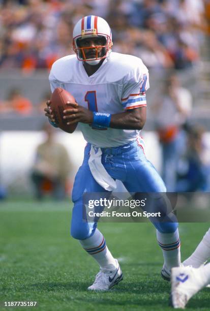 Quarterback Warren Moon of the Houston Oilers drops back to pass during an NFL football game circa 1990. Moon played for the Oilers from 1984-93.