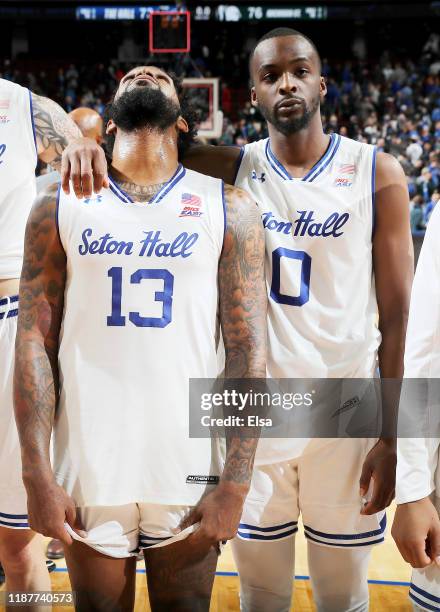 Myles Powell and Quincy McKnight of the Seton Hall Pirates react to the loss to the Michigan State Spartans at Prudential Center on November 14, 2019...