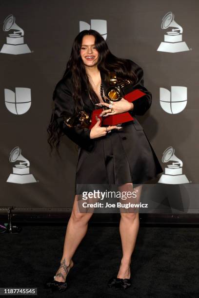 Singer Rosalia poses in the press room with the awards for Best Contemporary Pop Vocal Album, Album of the Year and Best Urban Song during the 20th...