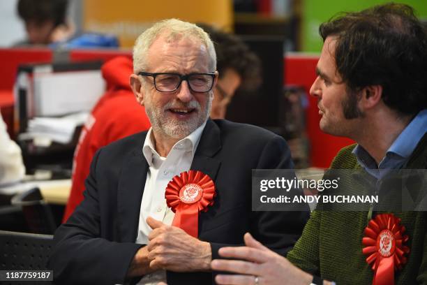 Opposition Labour party leader Jeremy Corbyn chats to a party activist as he mans the phones at a phone banking session in Glasgow, Scotland on...