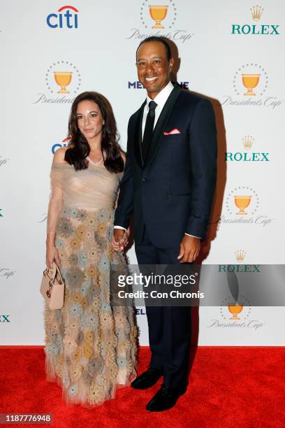 Team captain, Tiger Woods with his girlfriend, Erica Herman, pose on the red carpet during the Presidents Cup Gala prior to Presidents Cup at The...