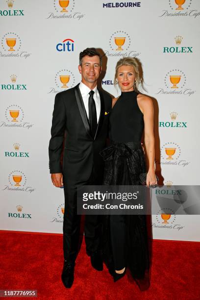International Team player, Adam Scott of Australia with is wife, Marie Kojzar, pose on the red carpet during the Presidents Cup Gala prior to...