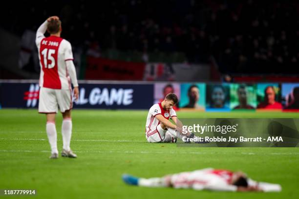 Dejected players of AFC Ajax react at full time during the UEFA Champions League group H match between AFC Ajax and Valencia CF at Amsterdam Arena on...