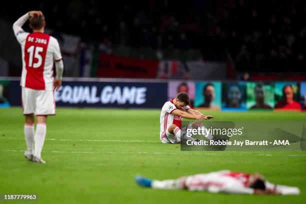 Dejected players of AFC Ajax react at full time during the UEFA Champions League group H match between AFC Ajax and Valencia CF at Amsterdam Arena on...