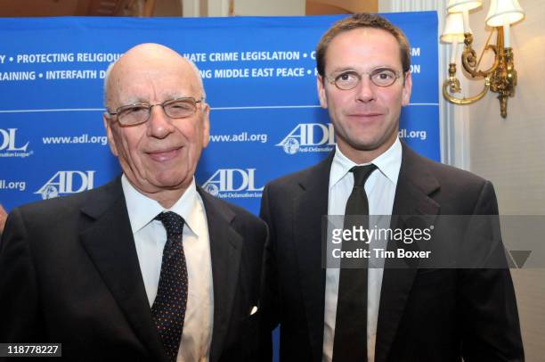 Rupert Murdoch, chairman and CEO of News Corporation, stands with his son James Murdoch, president and CEO of the corporation's Europe and Asia...