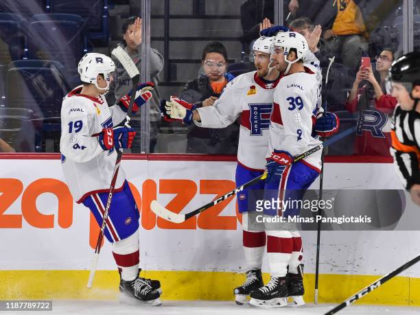 Dale Weise of the Laval Rocket celebrates his goal with teammates Antoine Waked and Kevin Lynch during the second period against the Cleveland...