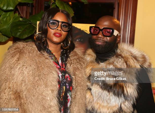 Fashion Bomb Daily's Claire Sulmers and Fur Designer Duckie Confetti pose at the celebration for the "North of 40" Podcast Launch at Dapper Dan...