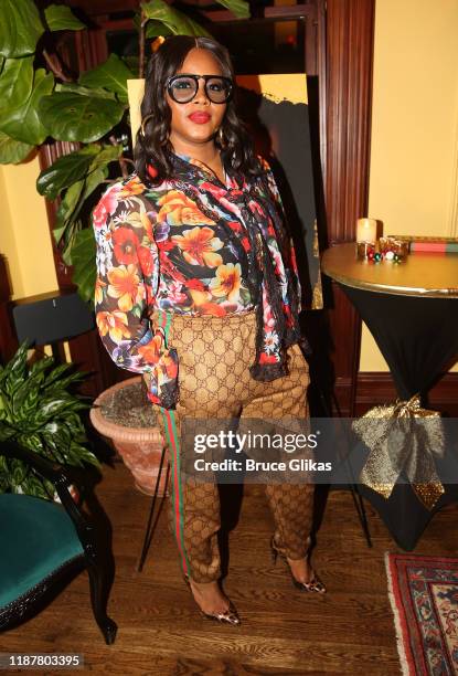 Fashion Bomb Daily's Claire Sulmers poses at the celebration for the "North of 40" Podcast Launch at Dapper Dan Atelier on November 14, 2019 in New...