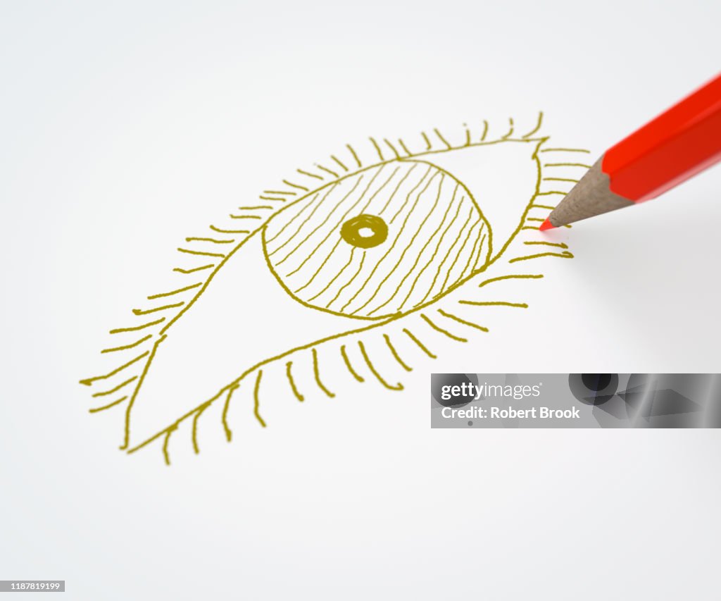 Red pencil drawing an eye in a different colour