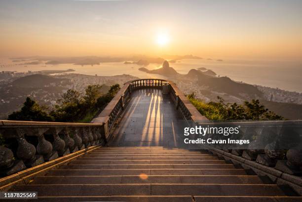 beautiful sunrise view from an empty corcovado mountain staircase - christ the redeemer rio stock pictures, royalty-free photos & images