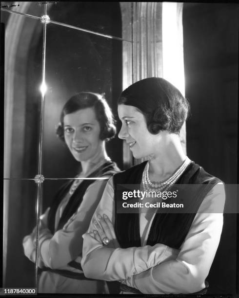 Vogue, June 15, 1931 - Adele Astaire looks into a mirror in Condé Nast's 1040 Park Avenue apartment.