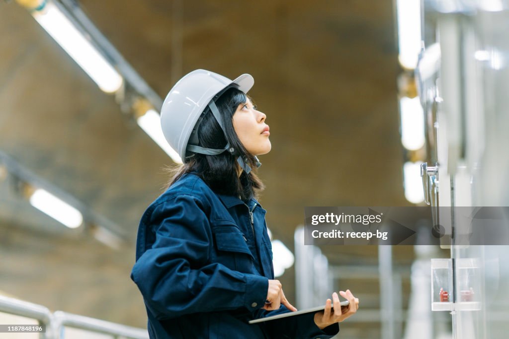 Young female engineer working at engineering facility