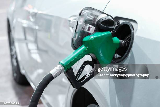 cropped of machine refueling car - station stock pictures, royalty-free photos & images