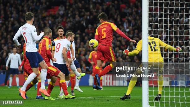 Harry Kane of England scores his first goal during the UEFA Euro 2020 qualifier between England and Montenegro at Wembley Stadium on November 14,...