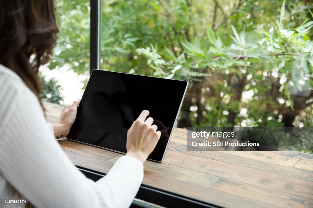 Woman using digital tablet