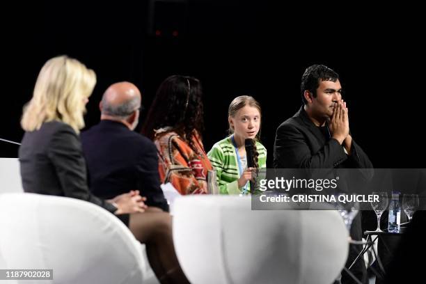 Swedish climate activist Greta Thunberg and Chilean indiginous activist Freddy Medina attend a high-level event on climate emergency hosted by the...