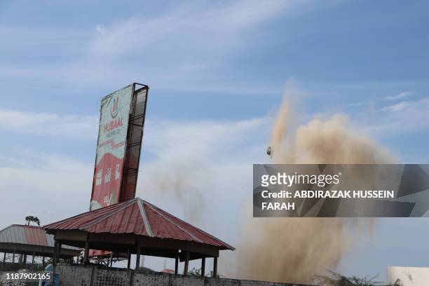Smoke rising over SYL hotel in Mogadishu after security forces detonated unexploded device in Mogadishu on December 11, 2019. - An attack by members...