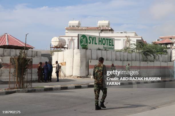 Somali government soldiers seen outside the SYL hotel in Mogadishu on December 11, 2019. - An attack by members of the radical Islamic group Al...