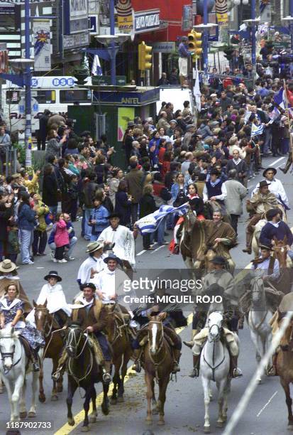 Gauchos march in Montevideo, Uruguay, 23 September 2000, during a civic and military parade held to commorate the 150th anniversary of the death of...