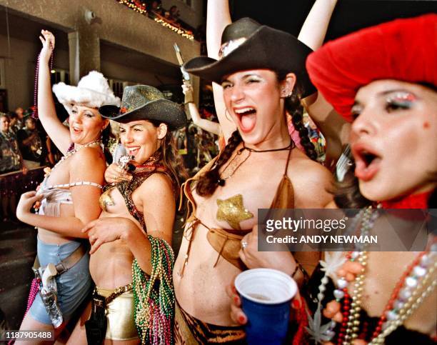 "Cowgirls" parad down Key West's Duval Street, FL, in the festival's highlight event, the BellSouth Fantasy Fest Parade 28 October, 2000. The parade,...