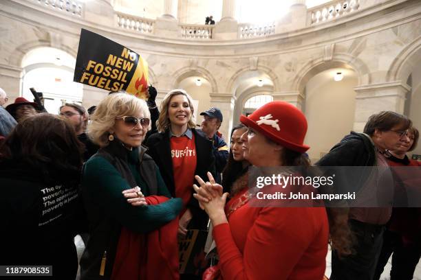 Jane Fonda, June Diane Raphael and Abigail Disney demonstrate inside the Russell US Senate office building during "Fire Drill Friday" climate change...