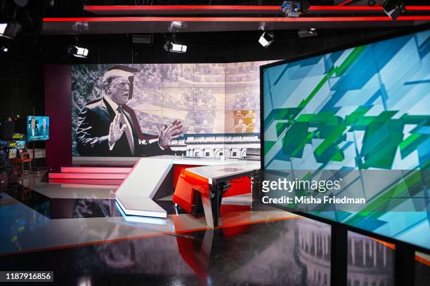International studios displaying an image of US President Donald Trump on December 6, 2019 in Moscow, Russia. RT, formerly known as Russia Today, is...