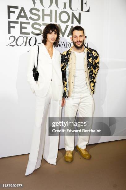 Mica Arganaraz and Simon Porte Jacquemus attend Vogue Fashion Festival Photocall At Hotel Potocki In Paris on November 15, 2019 in Paris, France.