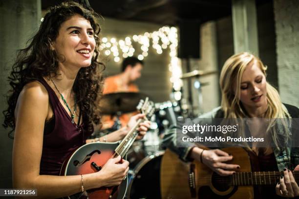 female musicians rehearsing together - mandolin stock pictures, royalty-free photos & images